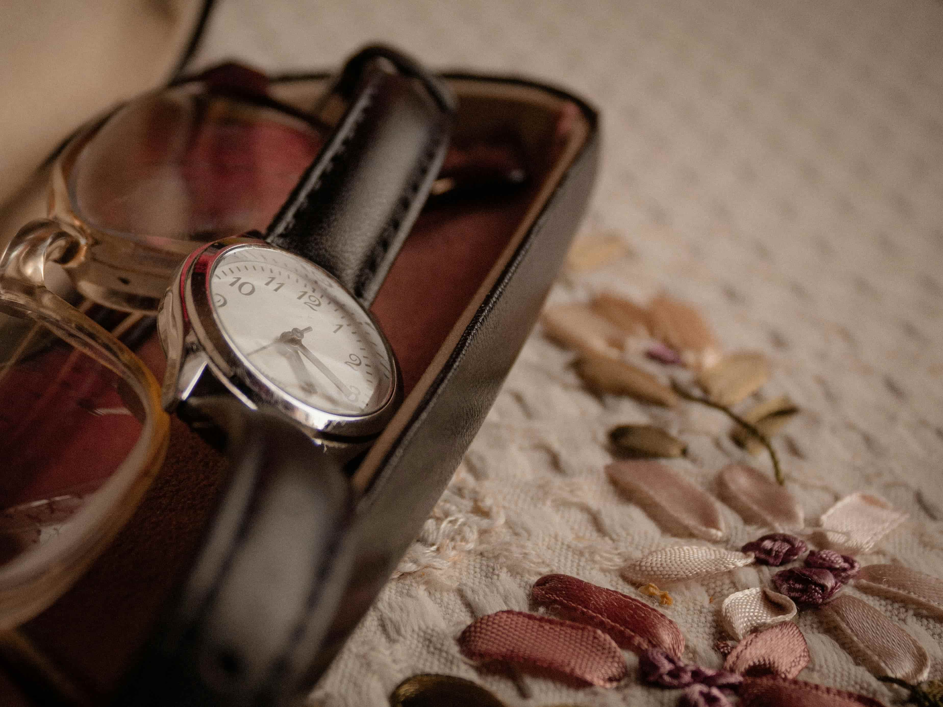 Vintage wristwatch stored in a leather case with service notes